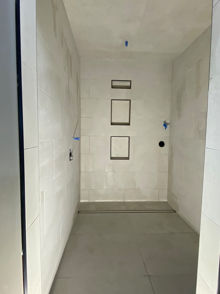 Recessed shower niches framed and set